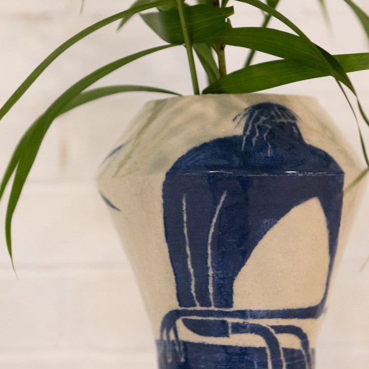 Vase by Damion Fuller with blue abstract design on a white background
